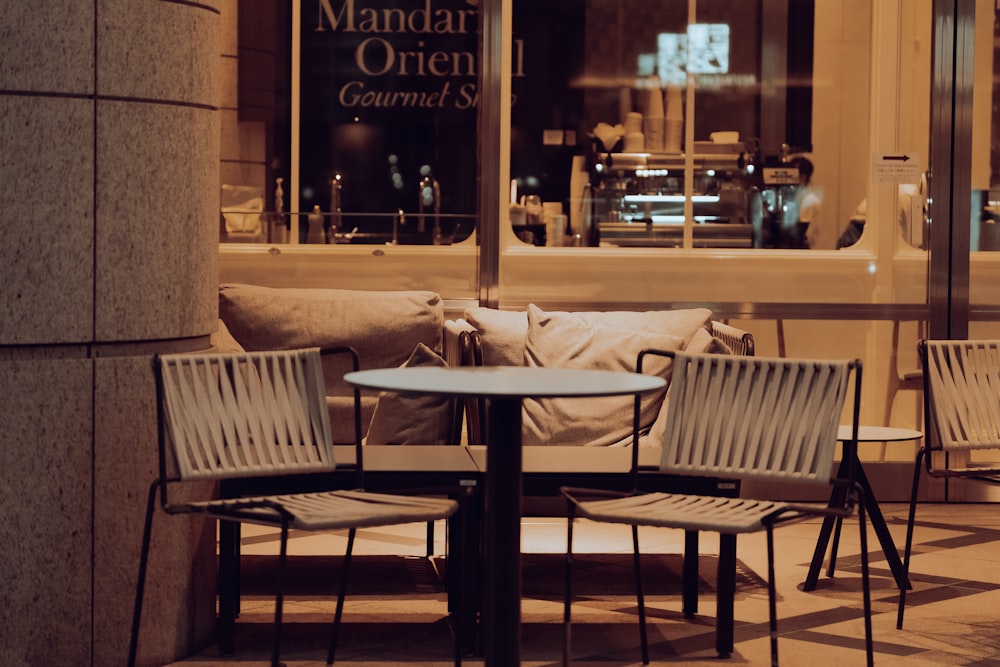 a couple of chairs sitting next to a table