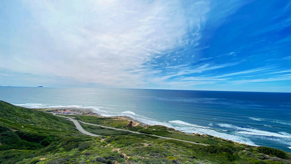 a scenic view of the ocean from a hill