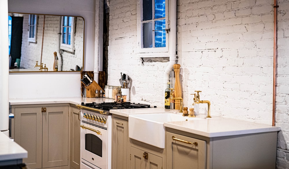 a kitchen with a sink, stove and a window