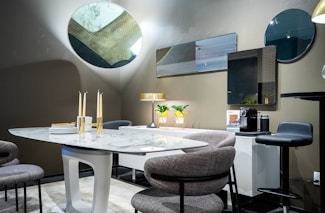 a dining room with a table and chairs