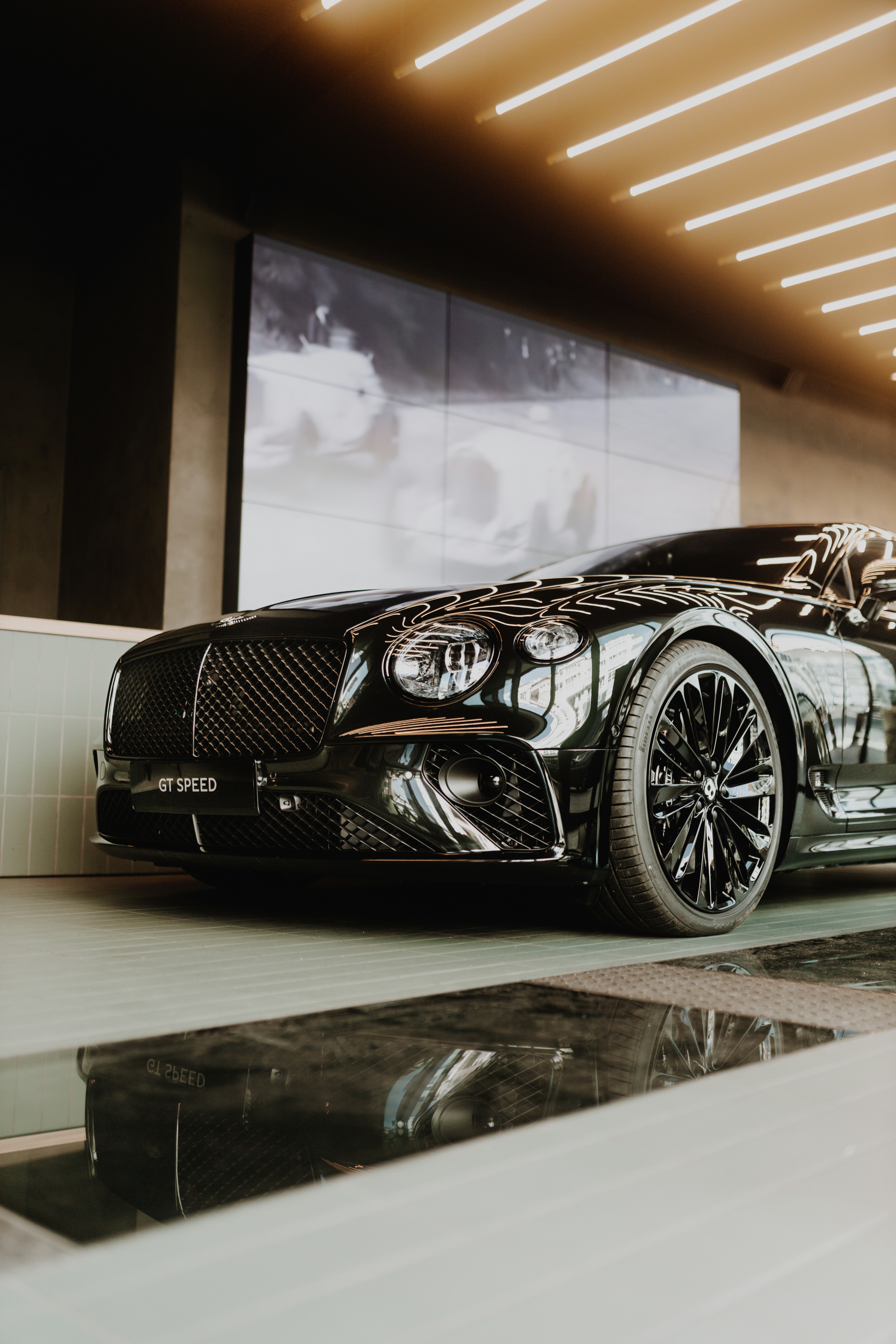 a black car parked in front of a building