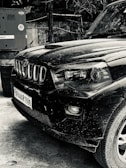 a black and white photo of a jeep