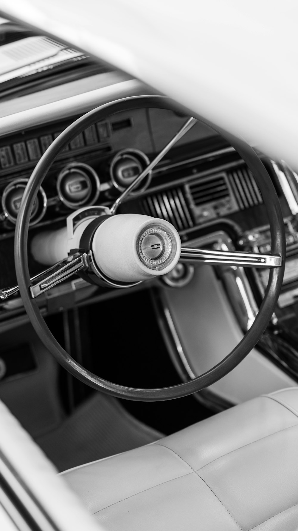 a black and white photo of a car dashboard