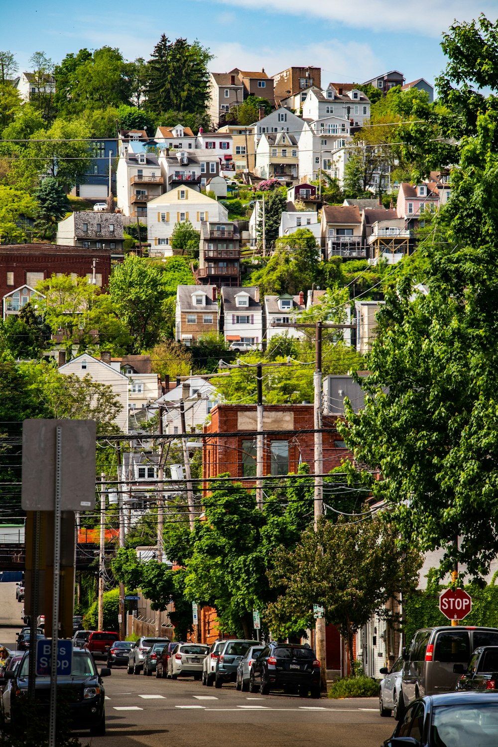 a city street with a hill in the background