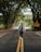 a man walking down the middle of a road