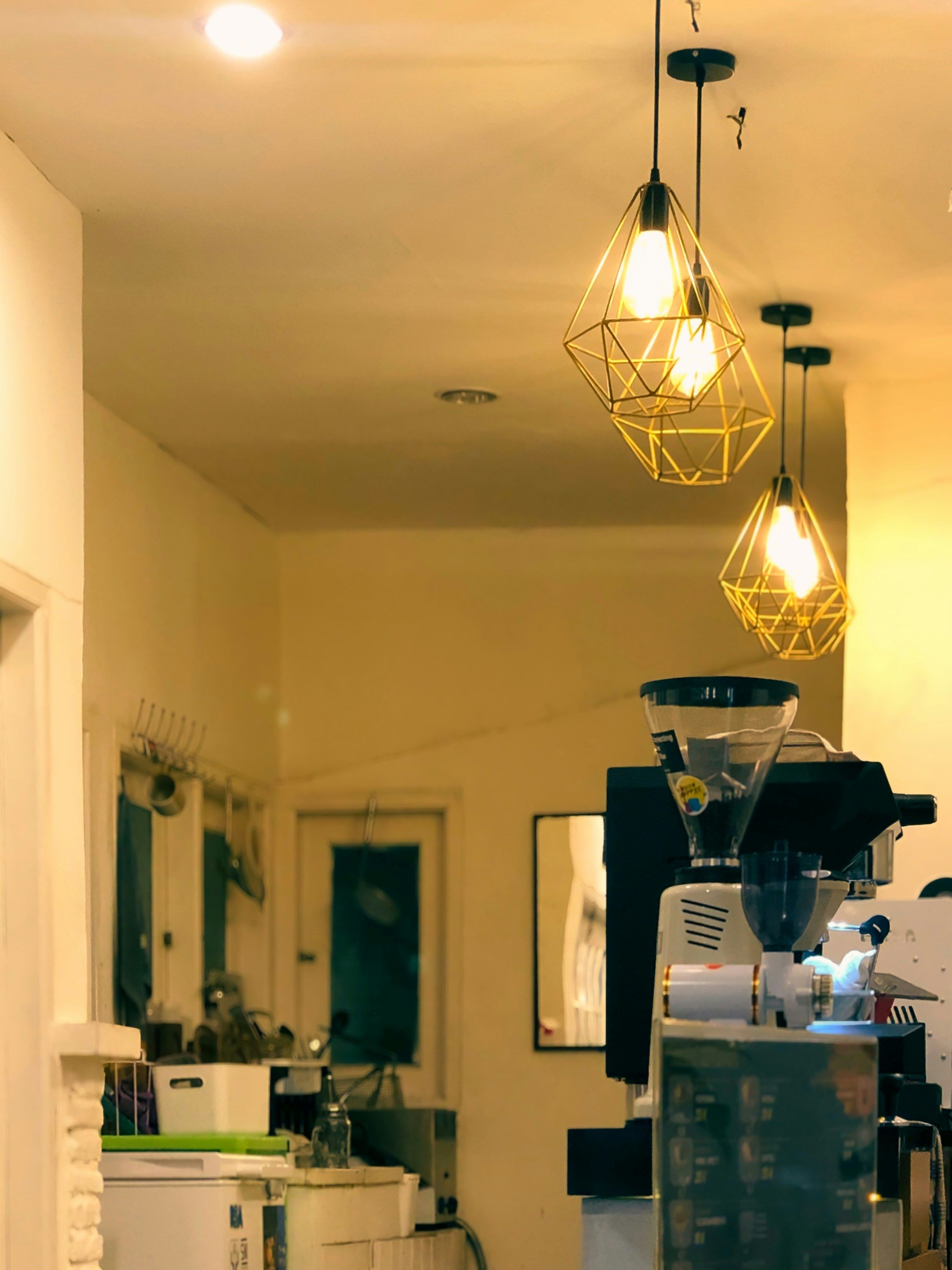 a coffee machine sitting inside of a kitchen