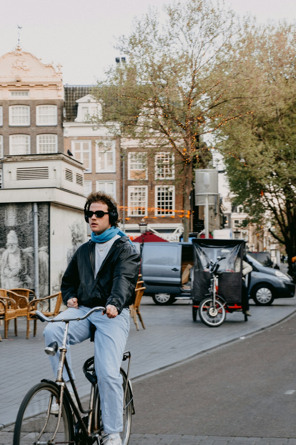 a man riding a bike down a street