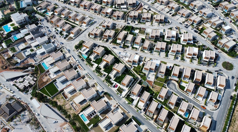 an aerial view of a city with lots of houses