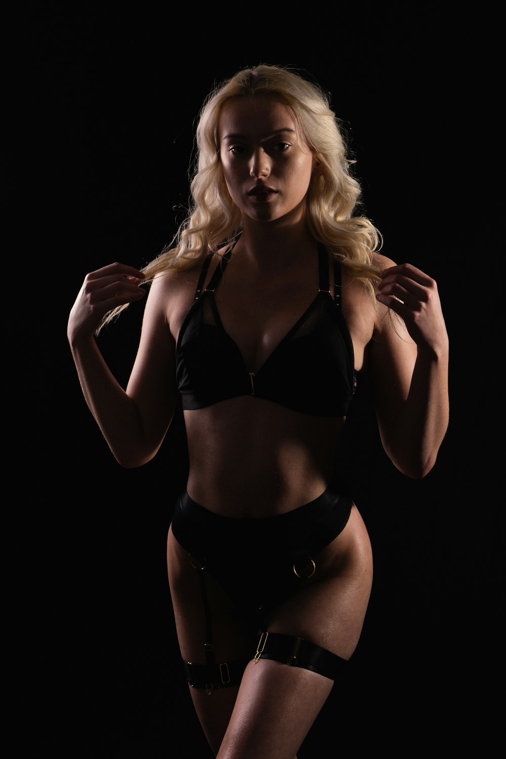 a woman in a black lingerie posing for a picture