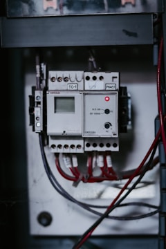 a close up of a control panel with wires