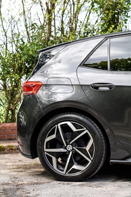 a grey car parked on the side of the road