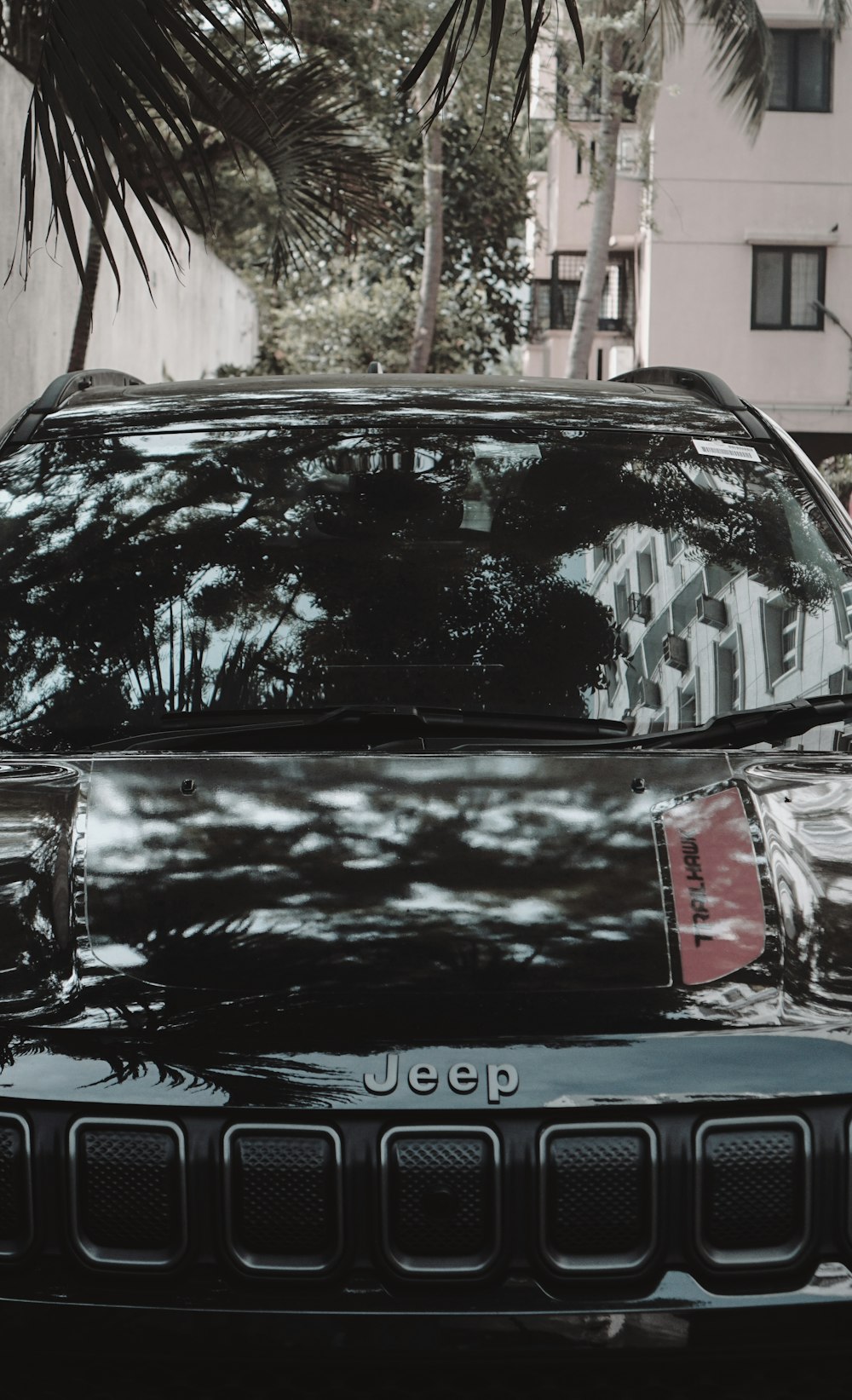 a black jeep parked on the side of the road