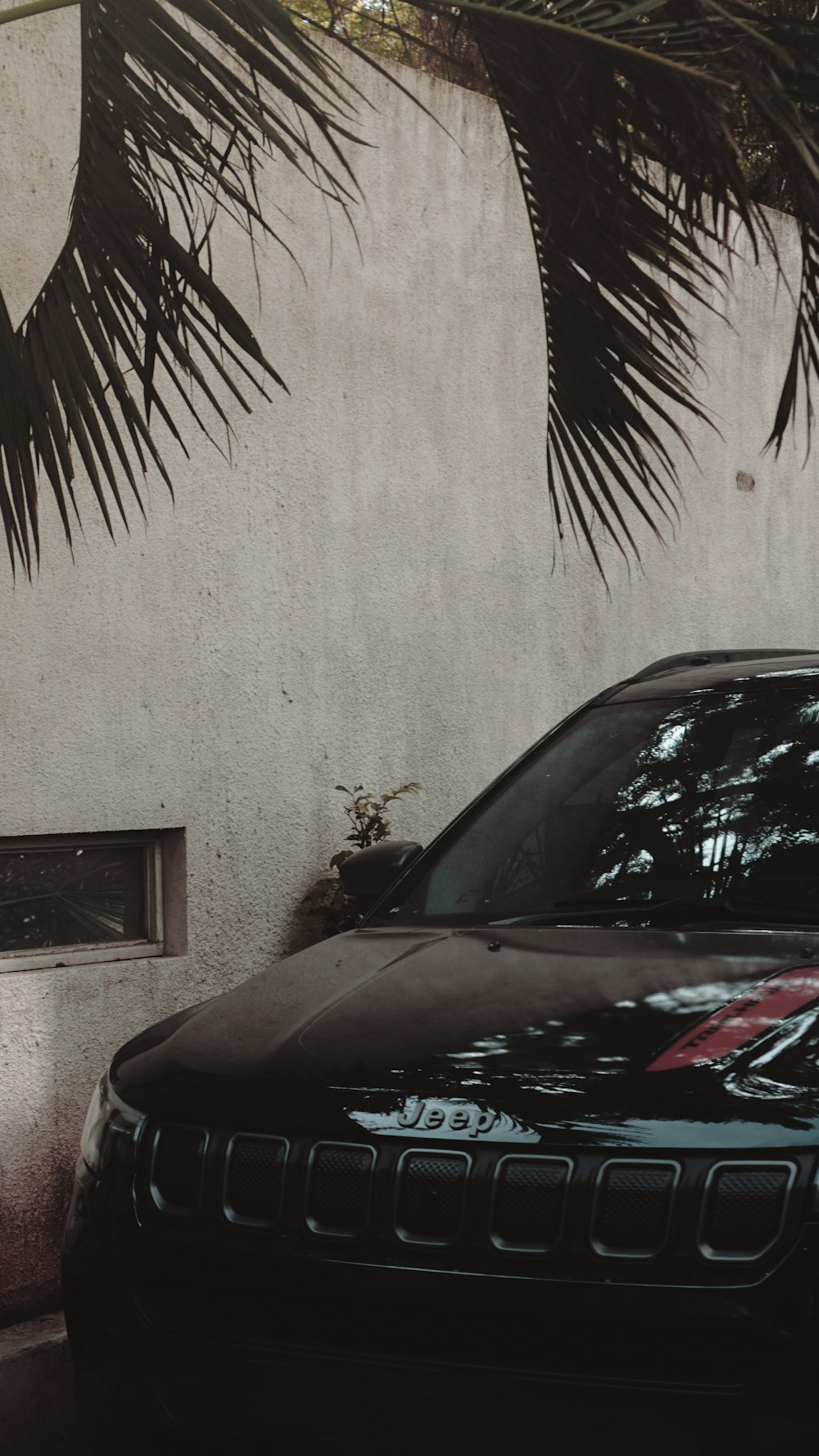 a black car parked in front of a building