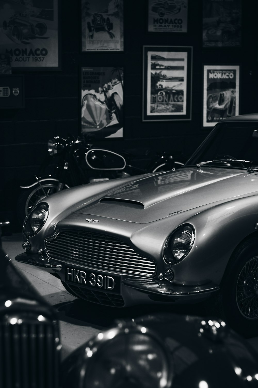 a black and white photo of a classic car