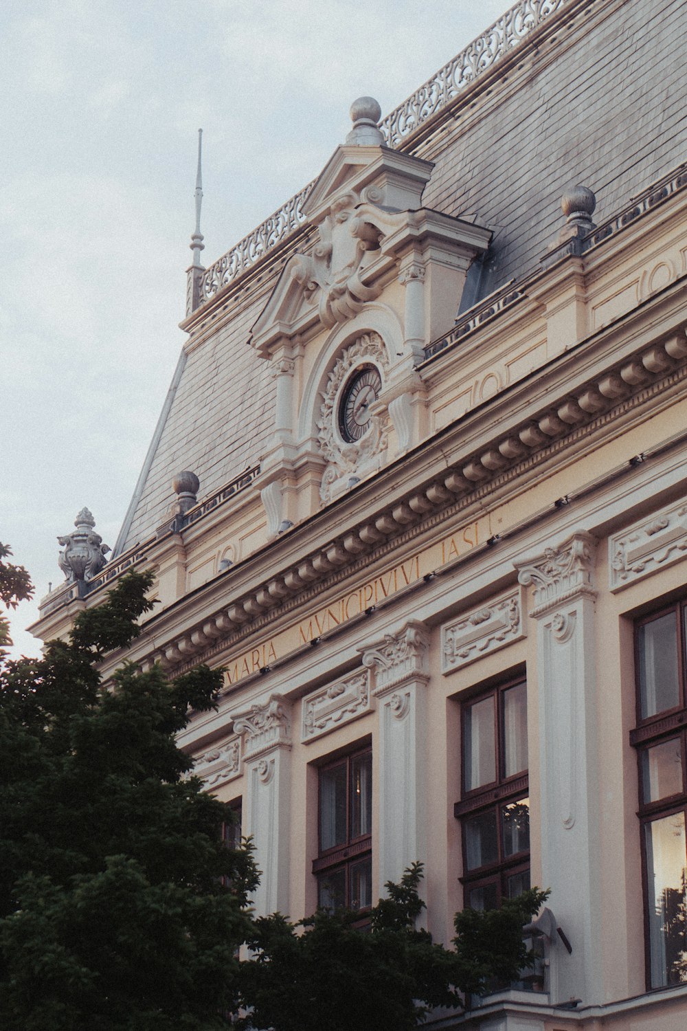 a large building with a clock on the top of it