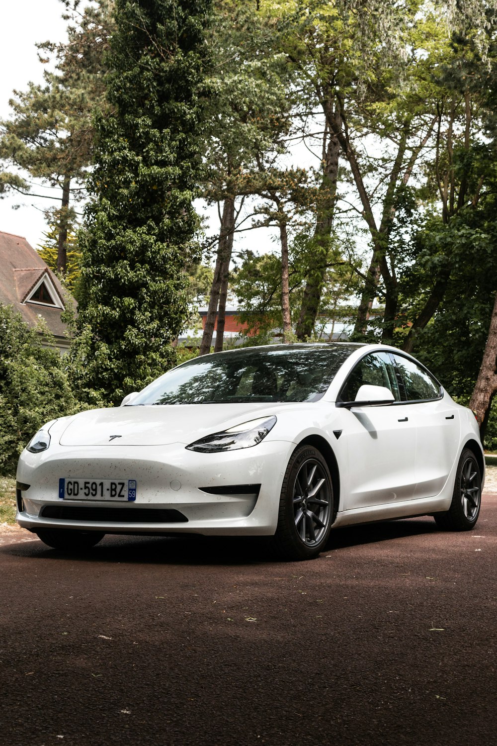 a white car parked on the side of the road