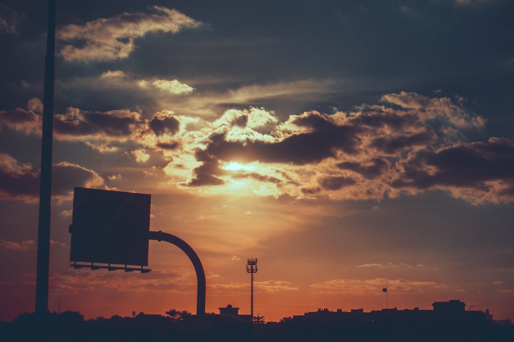 the sun is setting over a city skyline