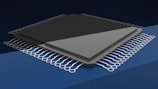 a close up of a computer chip on a blue background