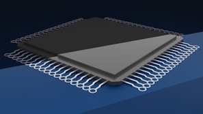 a close up of a computer chip on a blue background