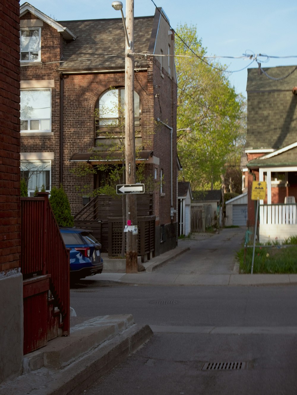 a street with a car parked on the side of it