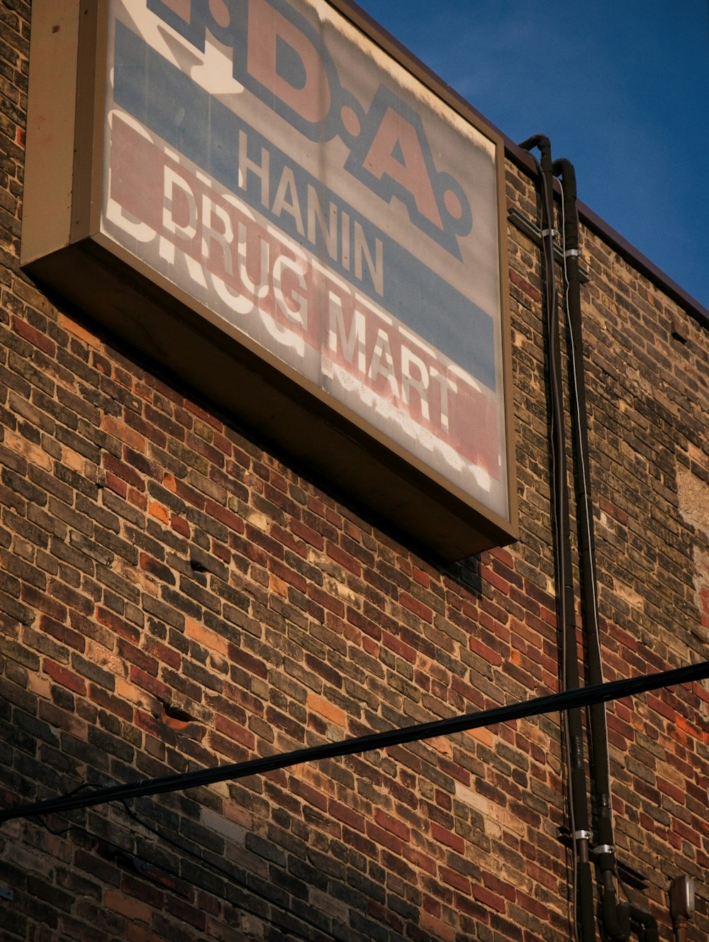 a sign on the side of a brick building