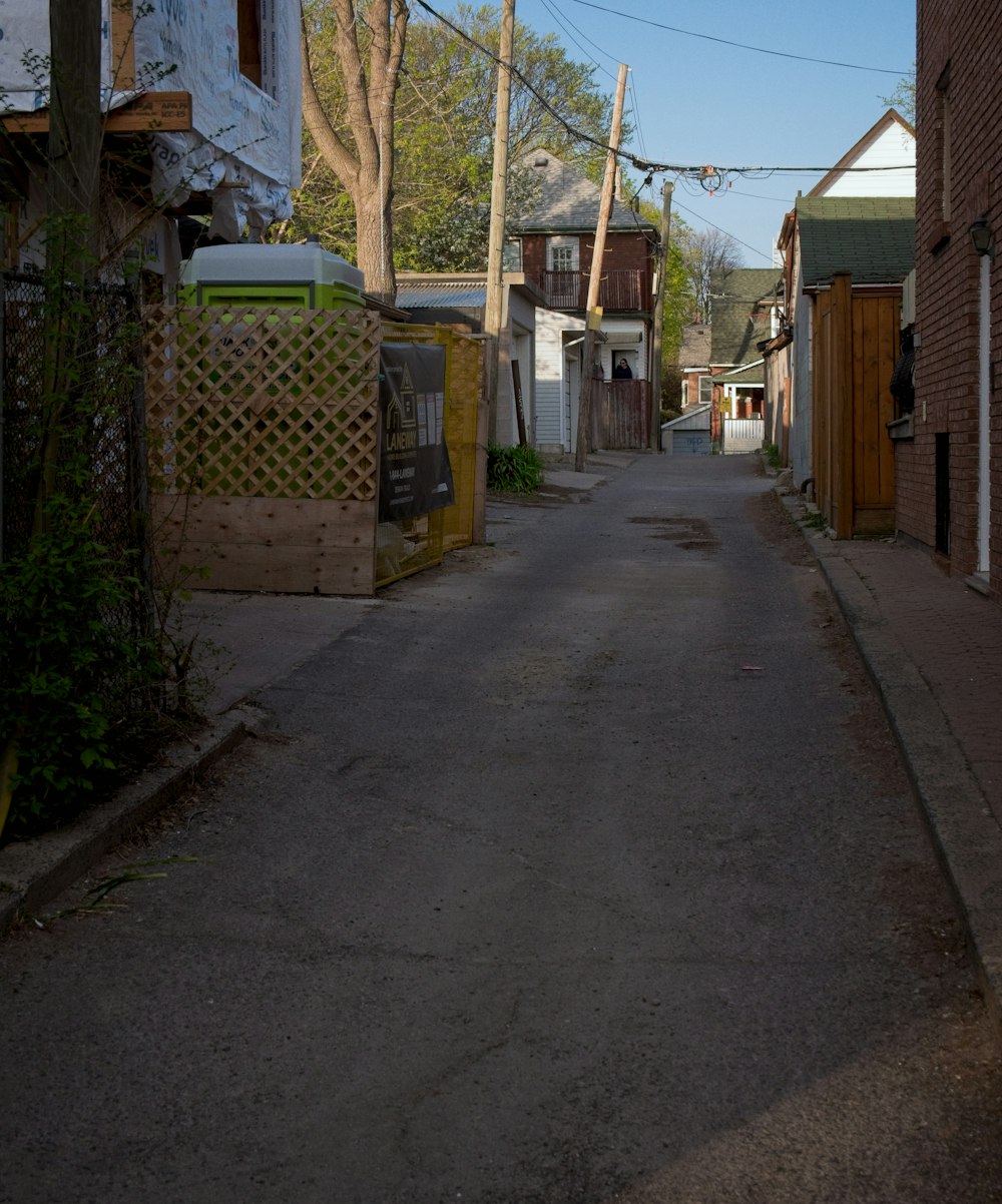 a narrow street with houses on both sides