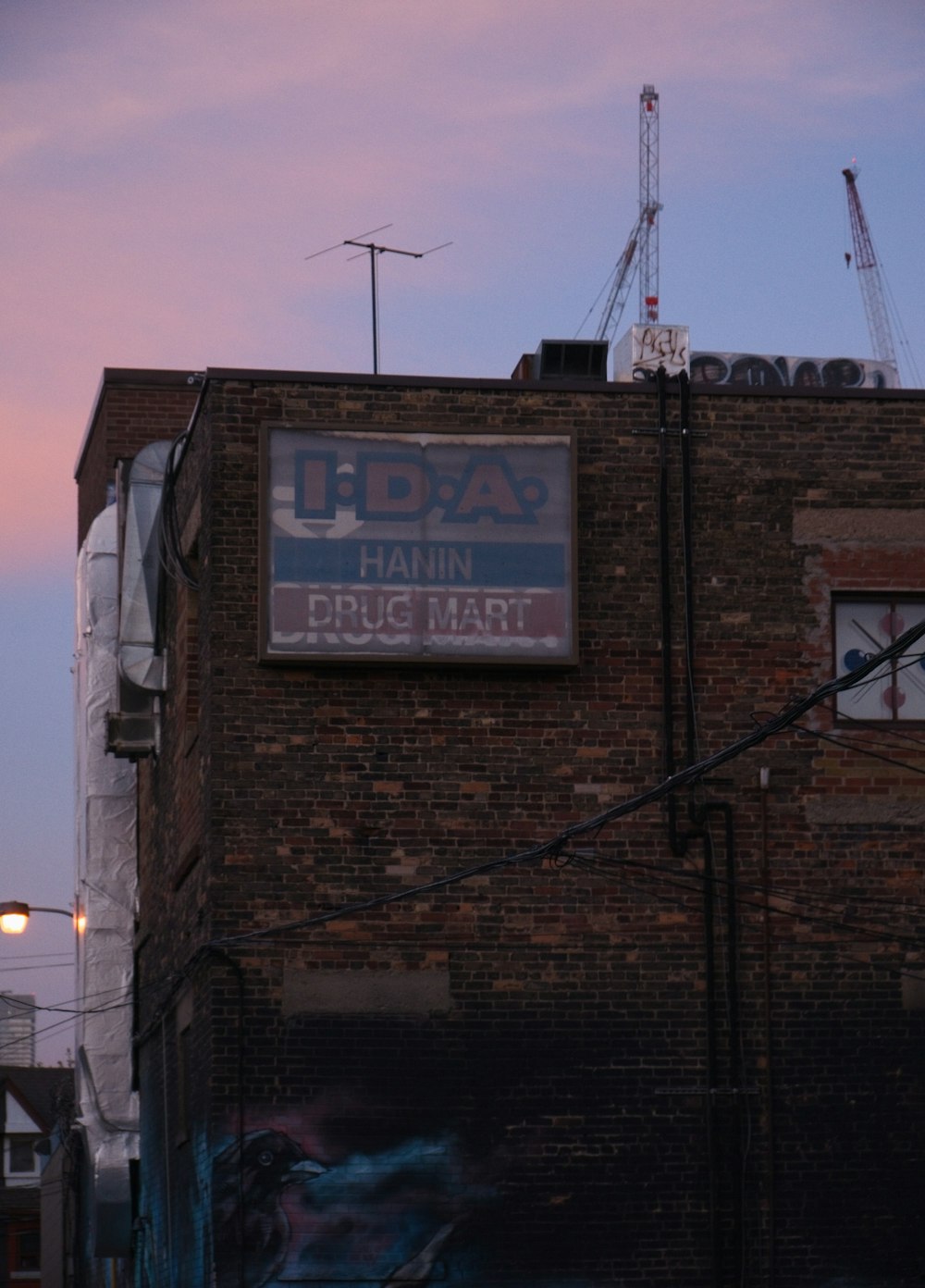a brick building with a sign on the side of it
