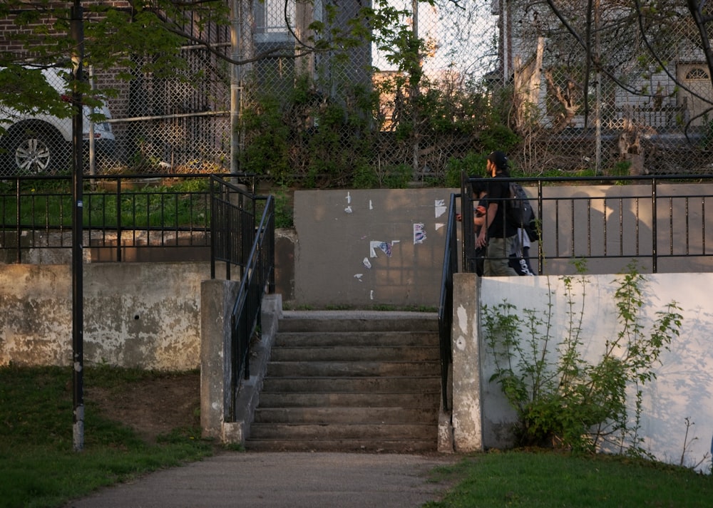 a man riding a skateboard down a set of stairs