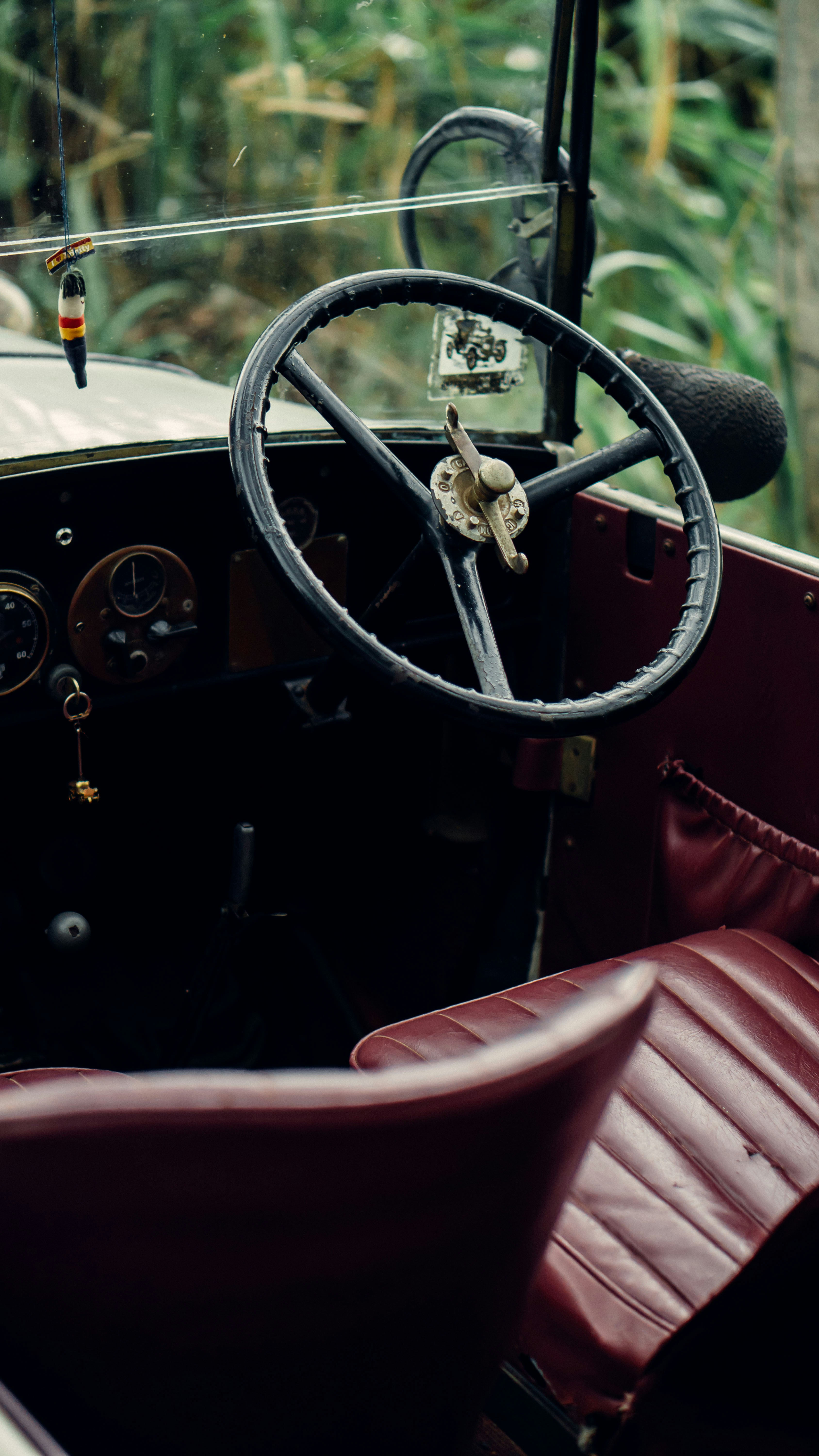 a steering wheel and dashboard of an old car