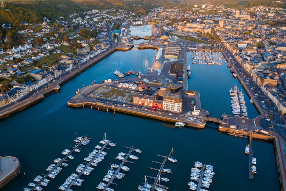 an aerial view of a marina with many boats