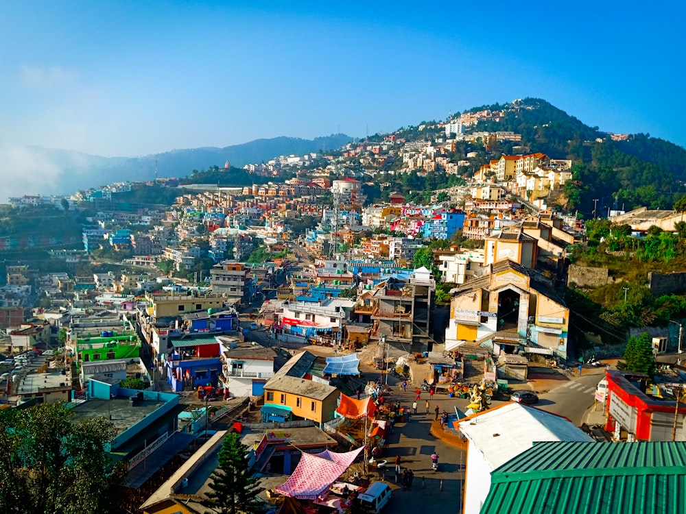 a city with lots of colorful houses on a hill