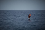 a person on a surfboard in the middle of the ocean