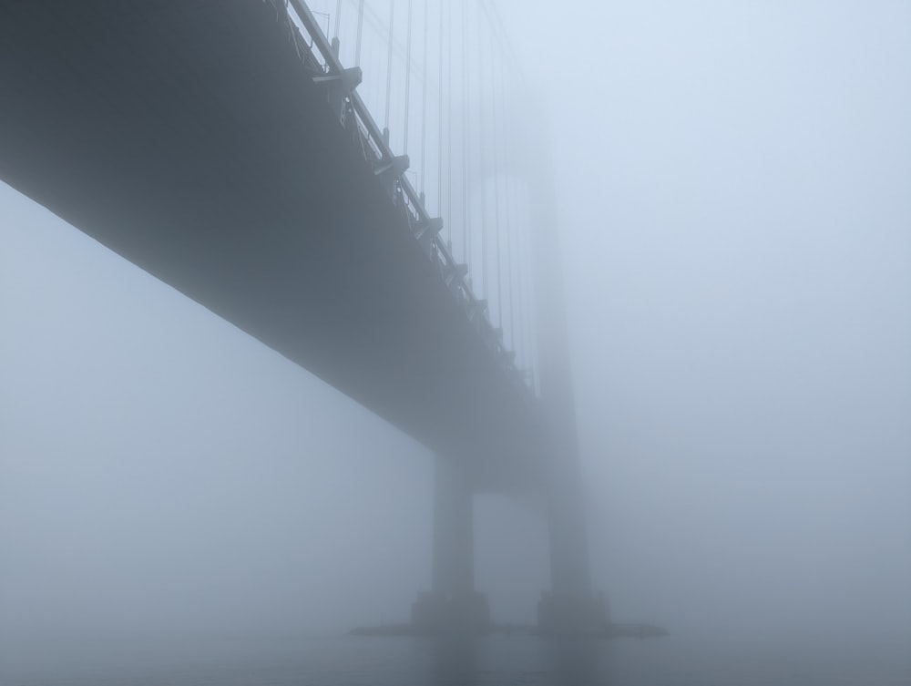 a foggy view of a large bridge