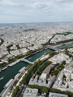 Bird's eye view of a sprawling city with a river running through it.