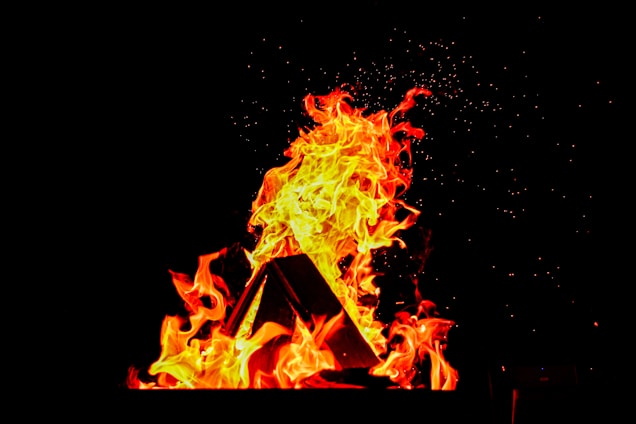 A mystical phoenix rising with golden flames and purple cosmic energy surrounding it.