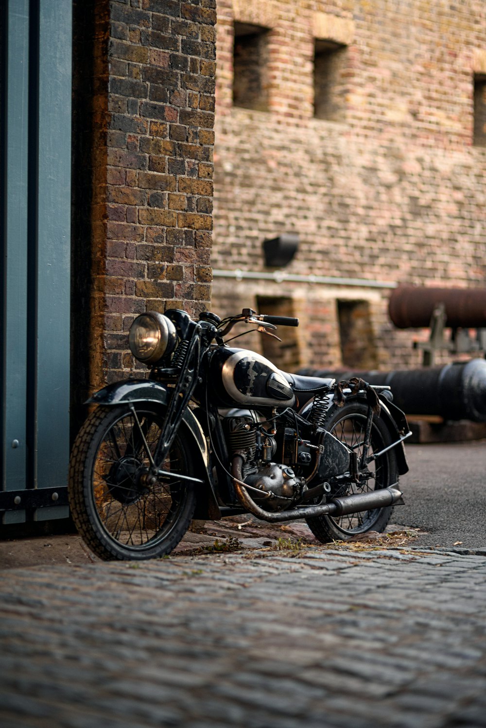 a motorcycle parked next to a brick building