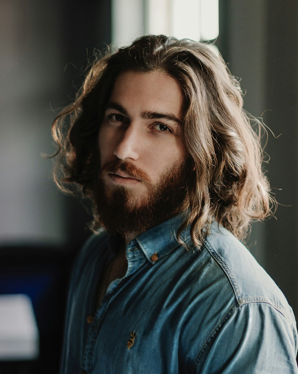 a man with long hair and a beard