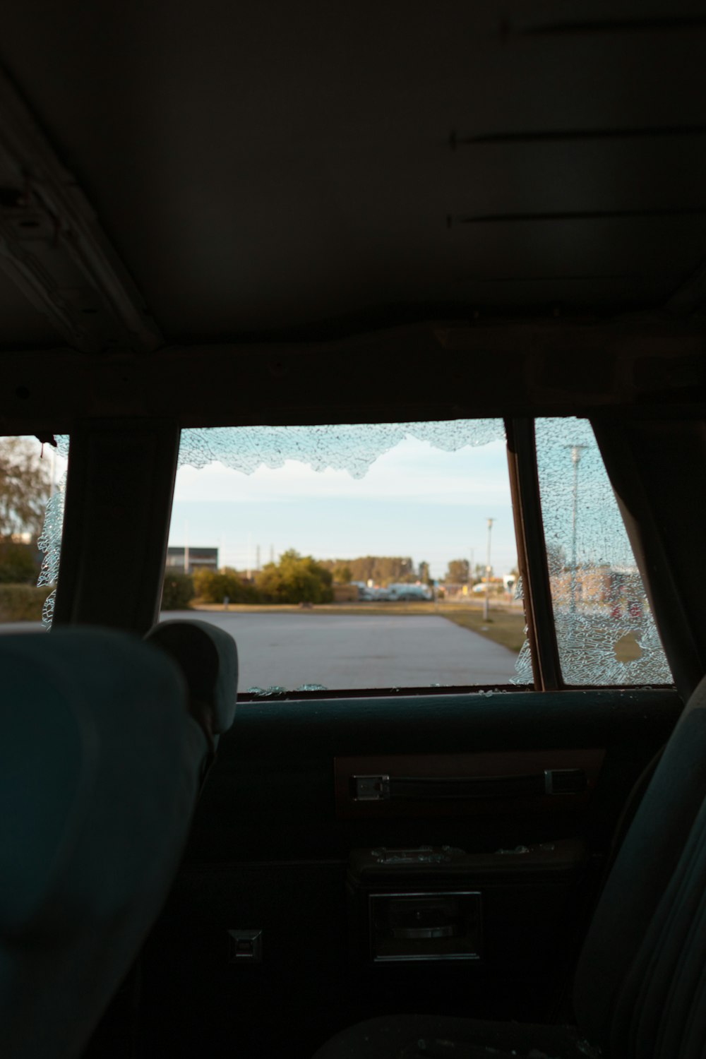 a view of a parking lot from inside a car
