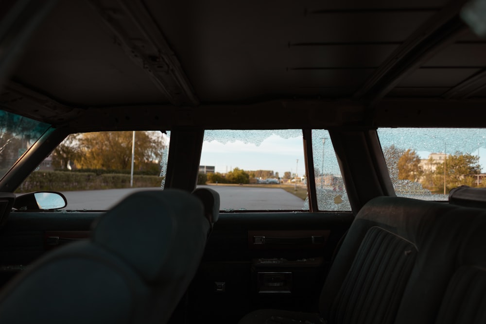 a view of a parking lot from inside a car