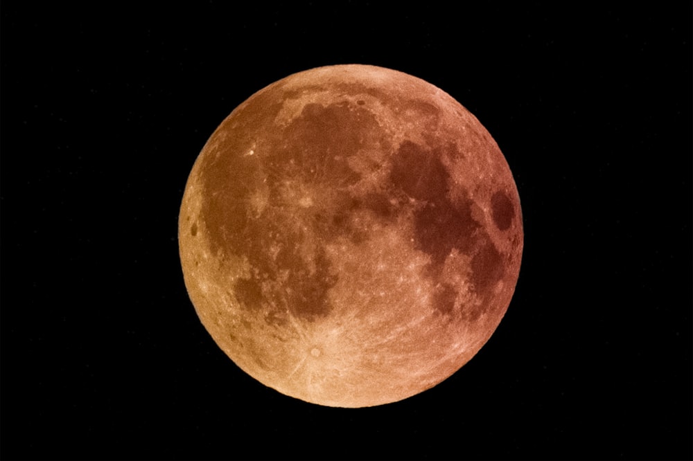 a full moon with a black sky background