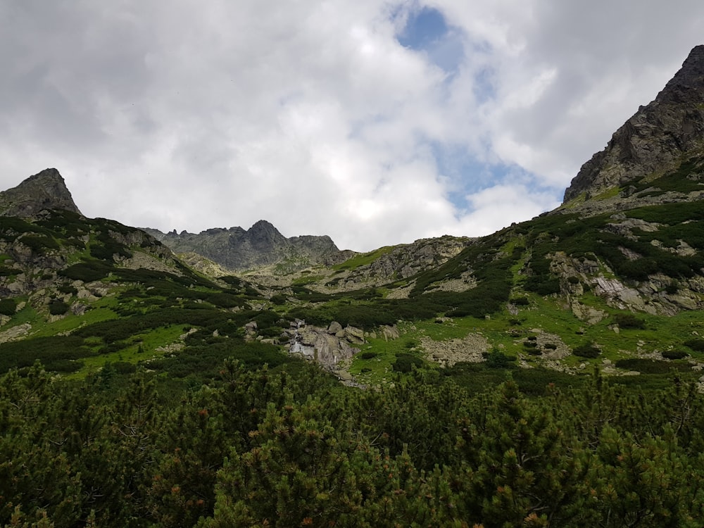 a view of a mountain range with a cloudy sky