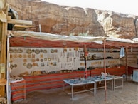 A close-up of a local market stall with fresh fruits and handmade crafts.