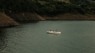a small boat in a large body of water