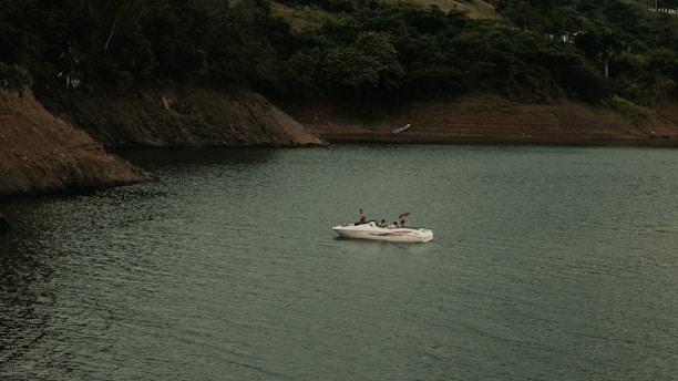 a small boat in a large body of water