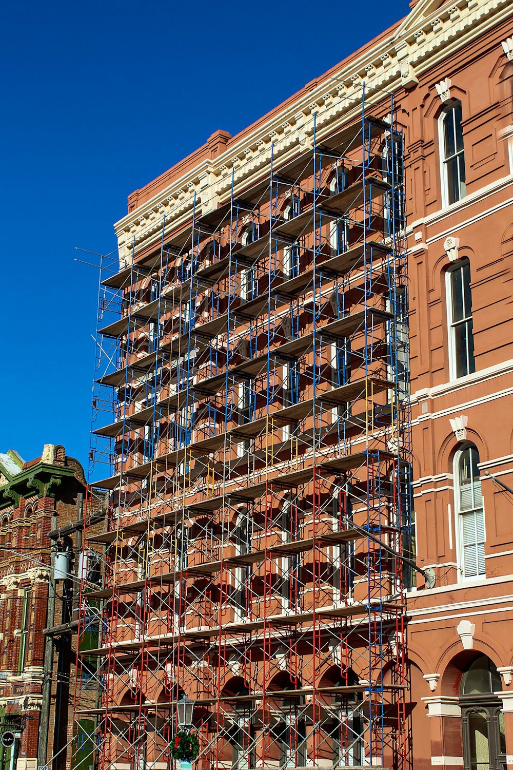 a large building with scaffolding on the side of it