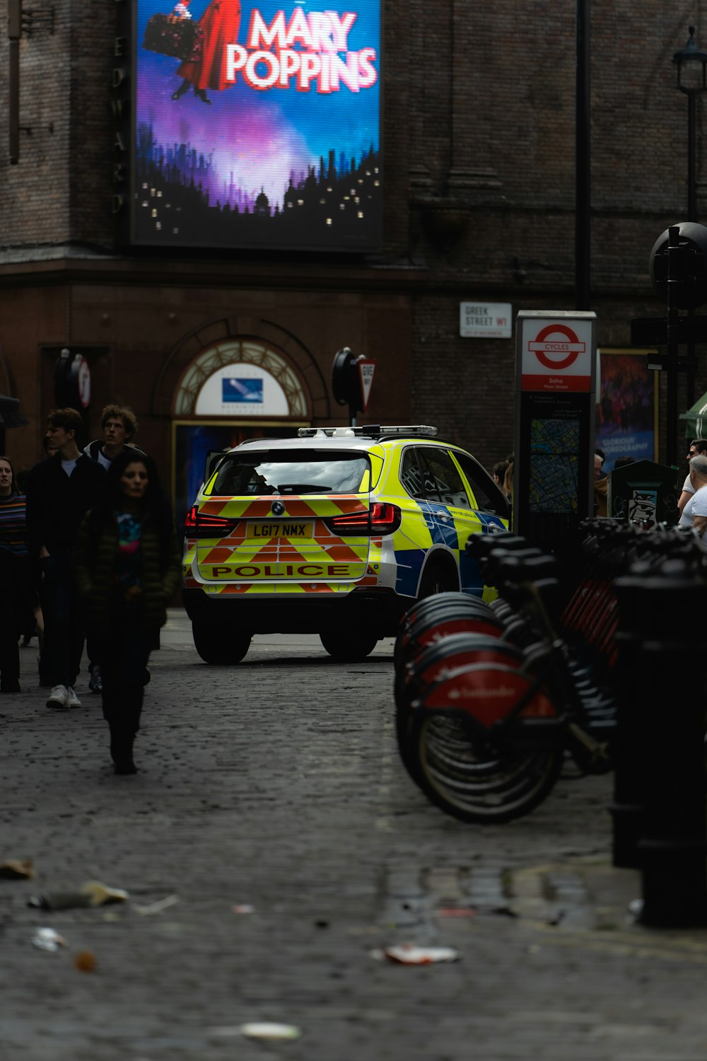 a police car parked on the side of a street