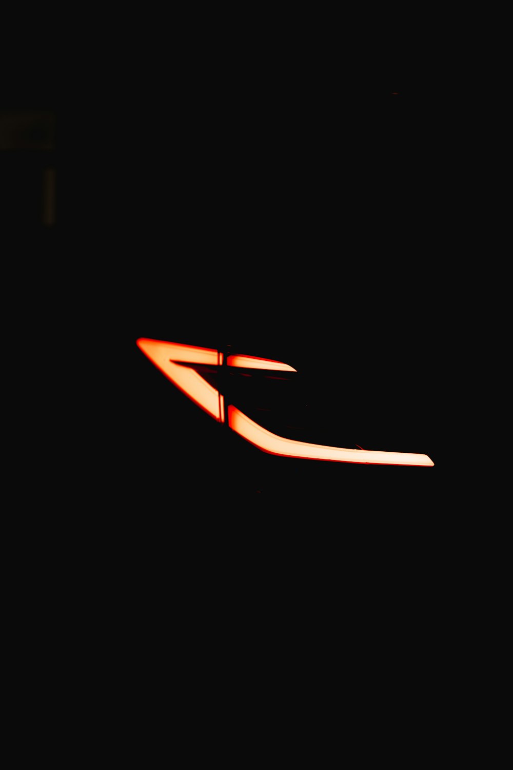 a close up of a street light in the dark