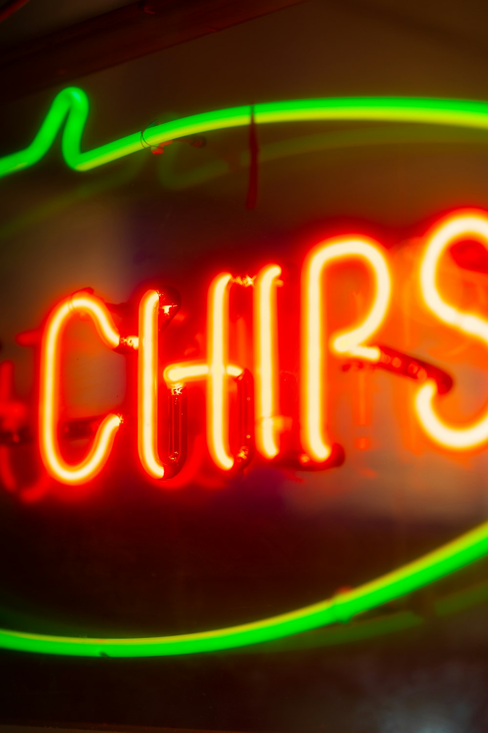 a neon sign that says chips on it