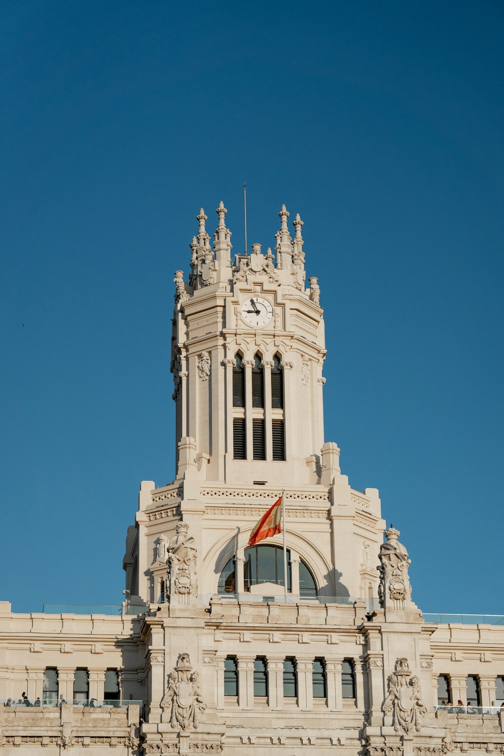 a tall building with a clock on the top of it