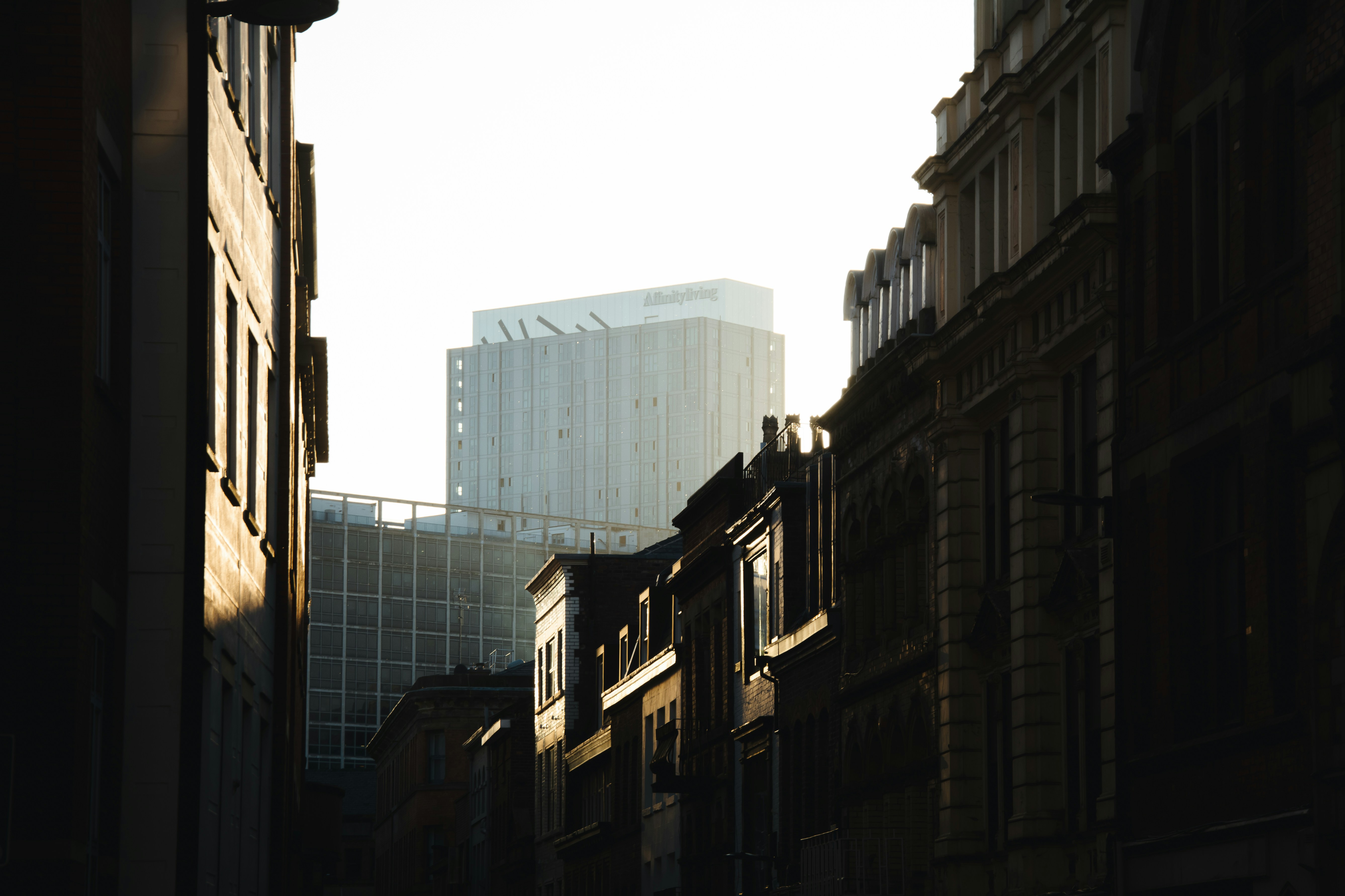 a city street with buildings and a traffic light